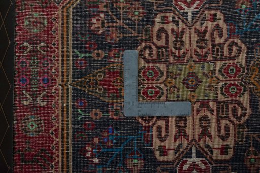 Backside of handmade 2000s Shiraz rug showing knot structure and weave density