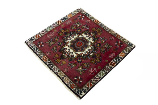 Corner detail of 2000s Shiraz rug showing border pattern and Wool pile