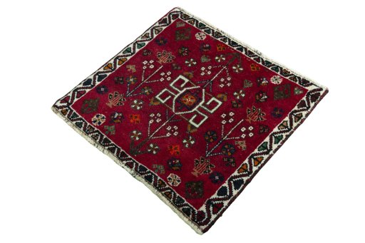 Corner detail of 2000s Shiraz rug showing border pattern and Wool pile