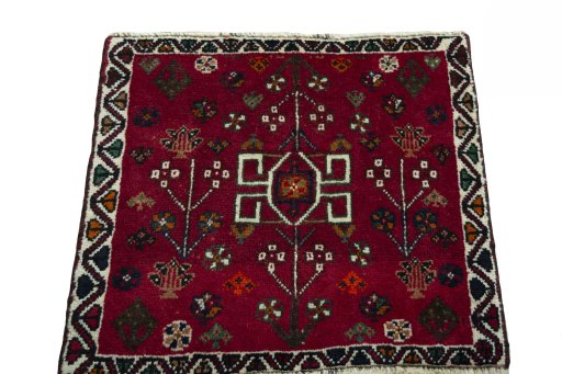 Surface texture of 2000s Shiraz rug with natural Wool and intricate pattern