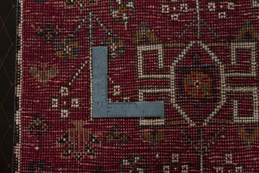 Backside of handmade 2000s Shiraz rug showing knot structure and weave density