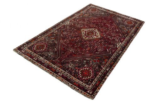 Corner detail of 2000s Shiraz rug showing border pattern and Wool pile