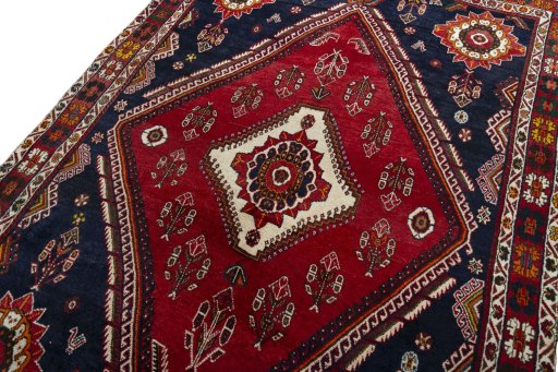 Backside of handmade 2000s Shiraz rug showing knot structure and weave density