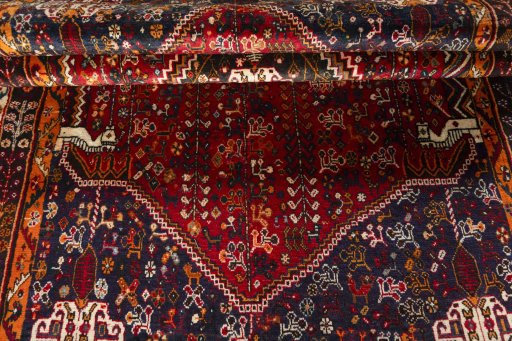 Corner detail of 2000s Shiraz rug showing border pattern and Wool pile