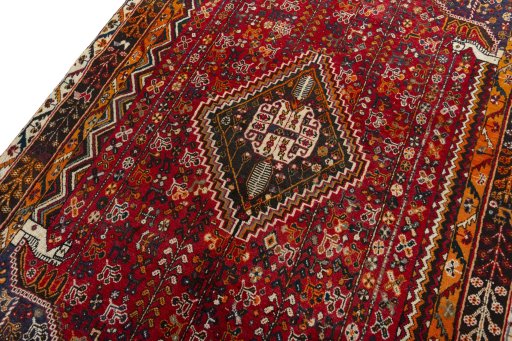 Backside of handmade 2000s Shiraz rug showing knot structure and weave density
