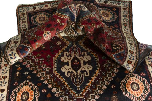 Corner detail of 2000s Shiraz rug showing border pattern and Wool pile