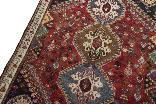 Backside of handmade 2000s Shiraz rug showing knot structure and weave density