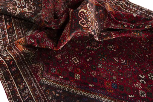 Surface texture of 1970s Shiraz rug with natural Wool and intricate pattern