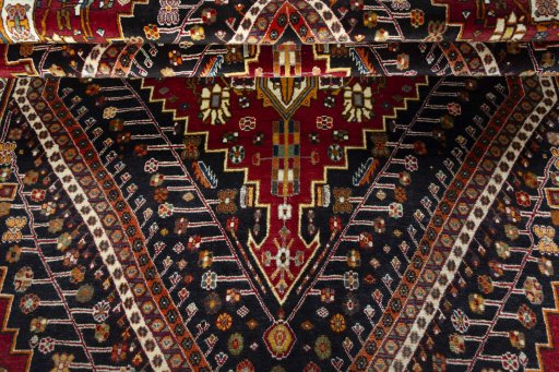 Corner detail of 2000s Shiraz rug showing border pattern and Wool pile