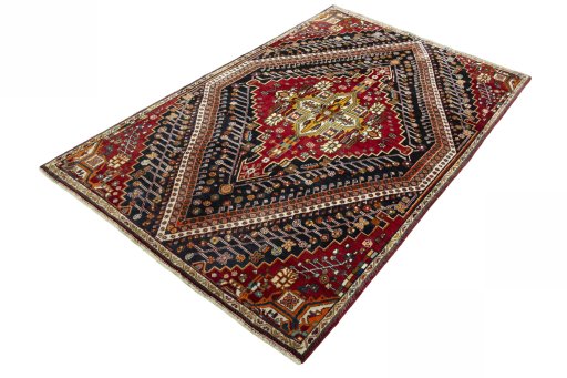 Corner detail of 2000s Shiraz rug showing border pattern and Wool pile