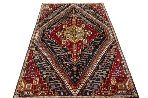 Surface texture of 2000s Shiraz rug with natural Wool and intricate pattern