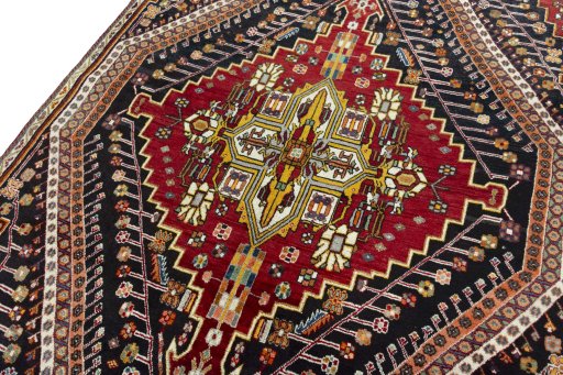 Backside of handmade 2000s Shiraz rug showing knot structure and weave density