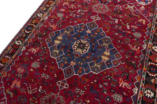 Backside of handmade 2000s Shiraz rug showing knot structure and weave density