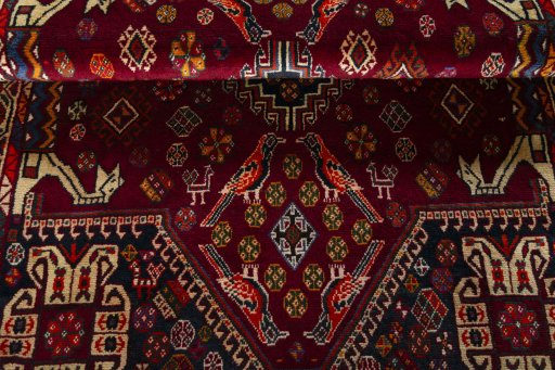 Corner detail of 2000s Shiraz rug showing border pattern and Wool pile
