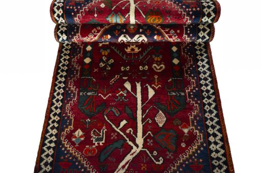 Corner detail of 2000s Shiraz rug showing border pattern and Wool pile