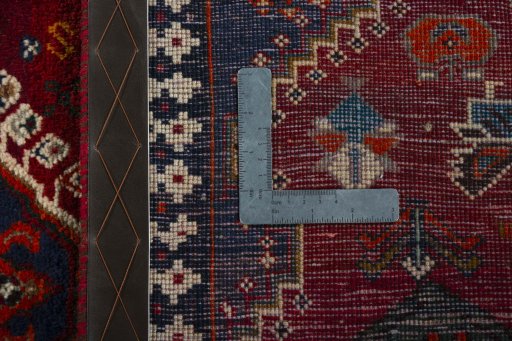 Surface texture of 2000s Shiraz rug with natural Wool and intricate pattern