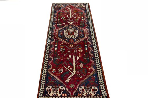 Surface texture of 2000s Shiraz rug with natural Wool and intricate pattern