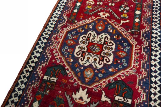 Backside of handmade 2000s Shiraz rug showing knot structure and weave density
