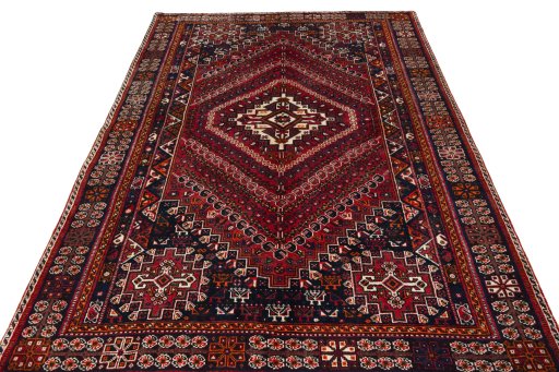 Surface texture of 2000s Shiraz rug with natural Wool and intricate pattern