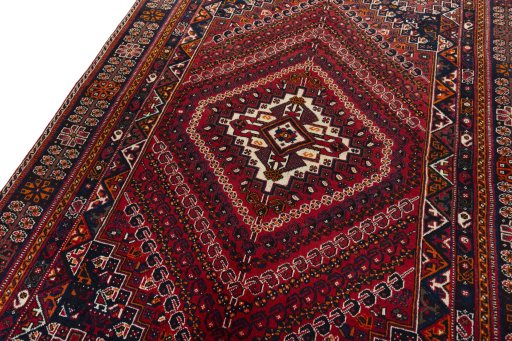 Backside of handmade 2000s Shiraz rug showing knot structure and weave density