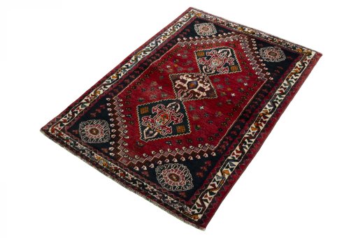 Corner detail of 2000s Shiraz rug showing border pattern and Wool pile