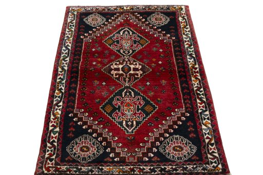 Surface texture of 2000s Shiraz rug with natural Wool and intricate pattern