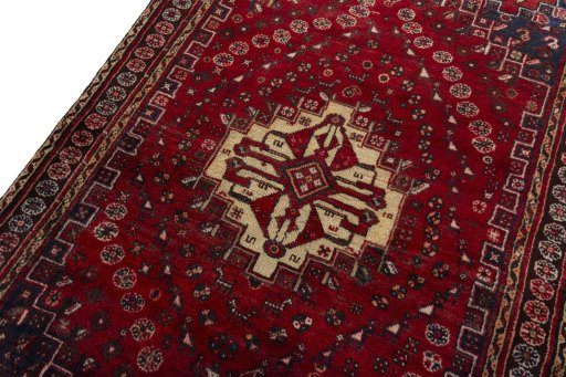 Backside of handmade 2000s Shiraz rug showing knot structure and weave density