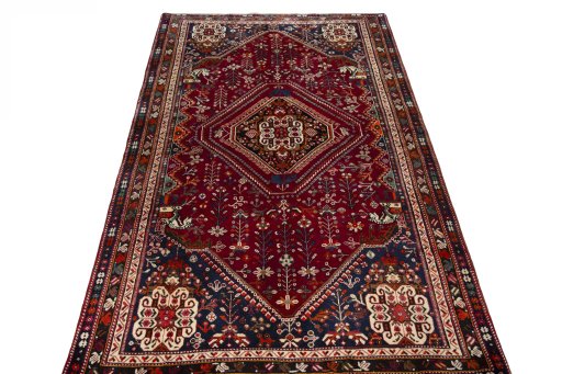 Surface texture of 2000s Shiraz rug with natural Wool and intricate pattern