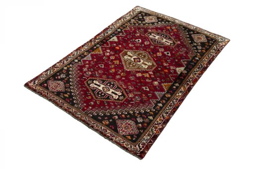 Corner detail of 2000s Shiraz rug showing border pattern and Wool pile