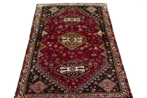 Surface texture of 2000s Shiraz rug with natural Wool and intricate pattern