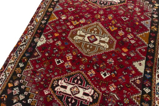 Backside of handmade 2000s Shiraz rug showing knot structure and weave density