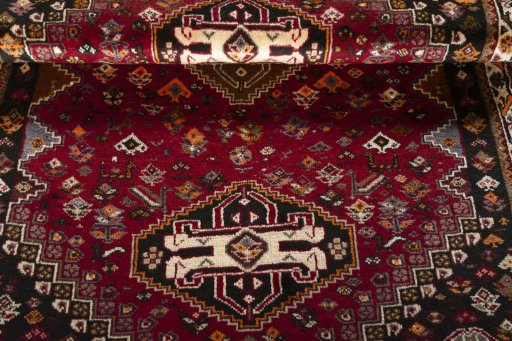 Full view of 2000s Shiraz rug from Iran / Persia, 175 × 118 cm in Red tones