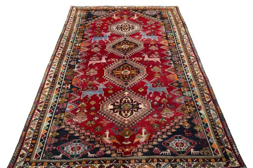 Surface texture of 2000s Shiraz rug with natural Wool and intricate pattern