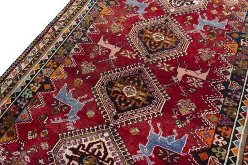 Backside of handmade 2000s Shiraz rug showing knot structure and weave density