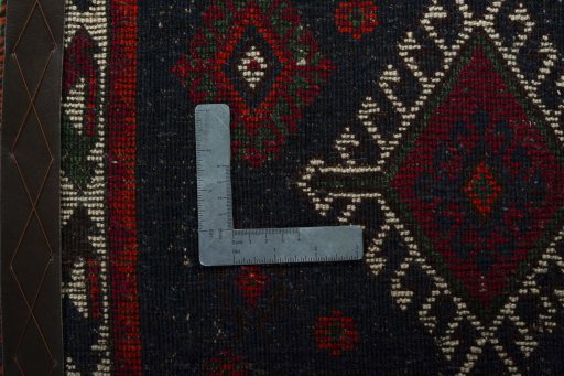 Backside of handmade 2000s Shiraz rug showing knot structure and weave density