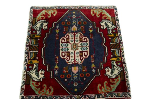 Surface texture of 2000s Shiraz rug with natural Wool and intricate pattern