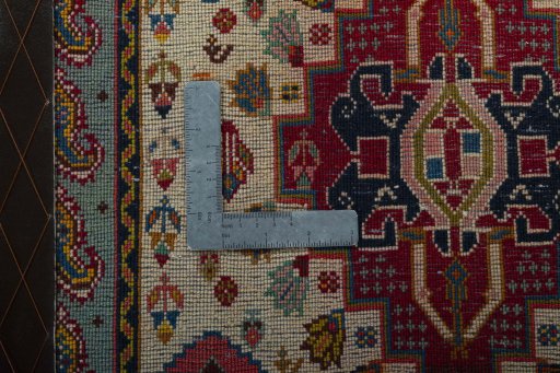 Backside of handmade 2000s Shiraz rug showing knot structure and weave density