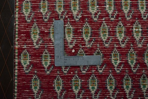 Backside of handmade 2000s Shiraz rug showing knot structure and weave density