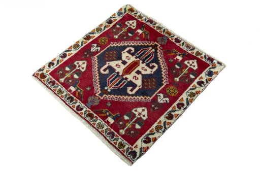 Corner detail of 2000s Shiraz rug showing border pattern and Wool pile