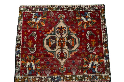 Surface texture of 2000s Shiraz rug with natural Wool and intricate pattern