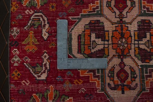 Backside of handmade 2000s Shiraz rug showing knot structure and weave density