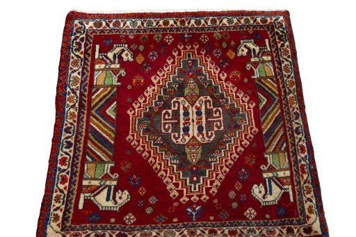 Surface texture of 2000s Shiraz rug with natural Wool and intricate pattern