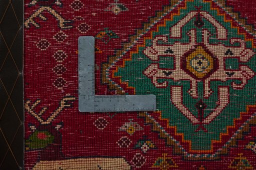 Backside of handmade 2000s Shiraz rug showing knot structure and weave density