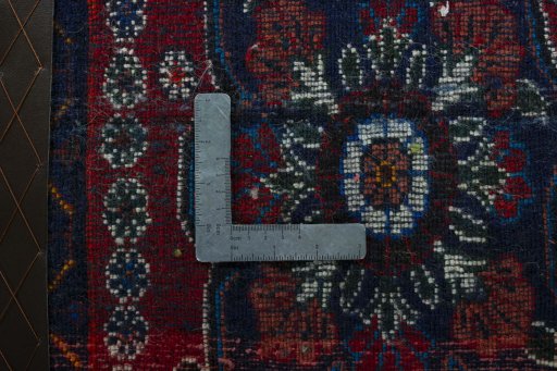 Backside of handmade 2000s Shiraz rug showing knot structure and weave density
