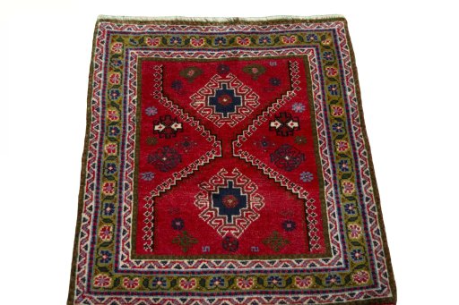Surface texture of 2000s Shiraz rug with natural Wool and intricate pattern