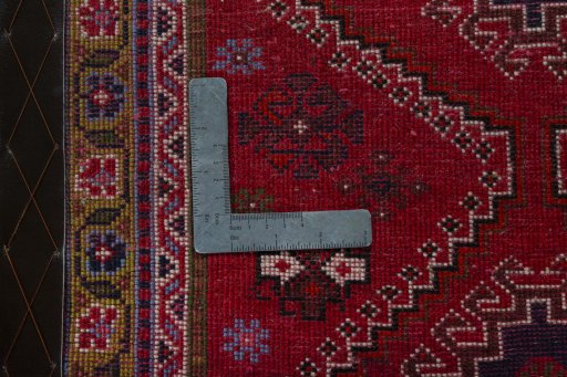 Backside of handmade 2000s Shiraz rug showing knot structure and weave density