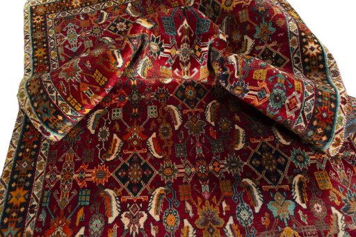 Corner detail of 2000s Shiraz rug showing border pattern and Wool pile