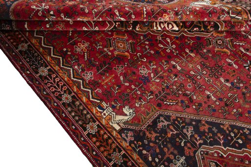 Corner detail of 2000s Shiraz rug showing border pattern and Wool pile