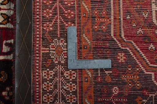 Surface texture of 2000s Shiraz rug with natural Wool and intricate pattern