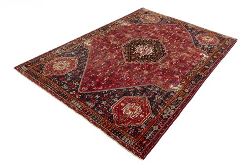 Corner detail of 2000s Shiraz rug showing border pattern and Wool pile